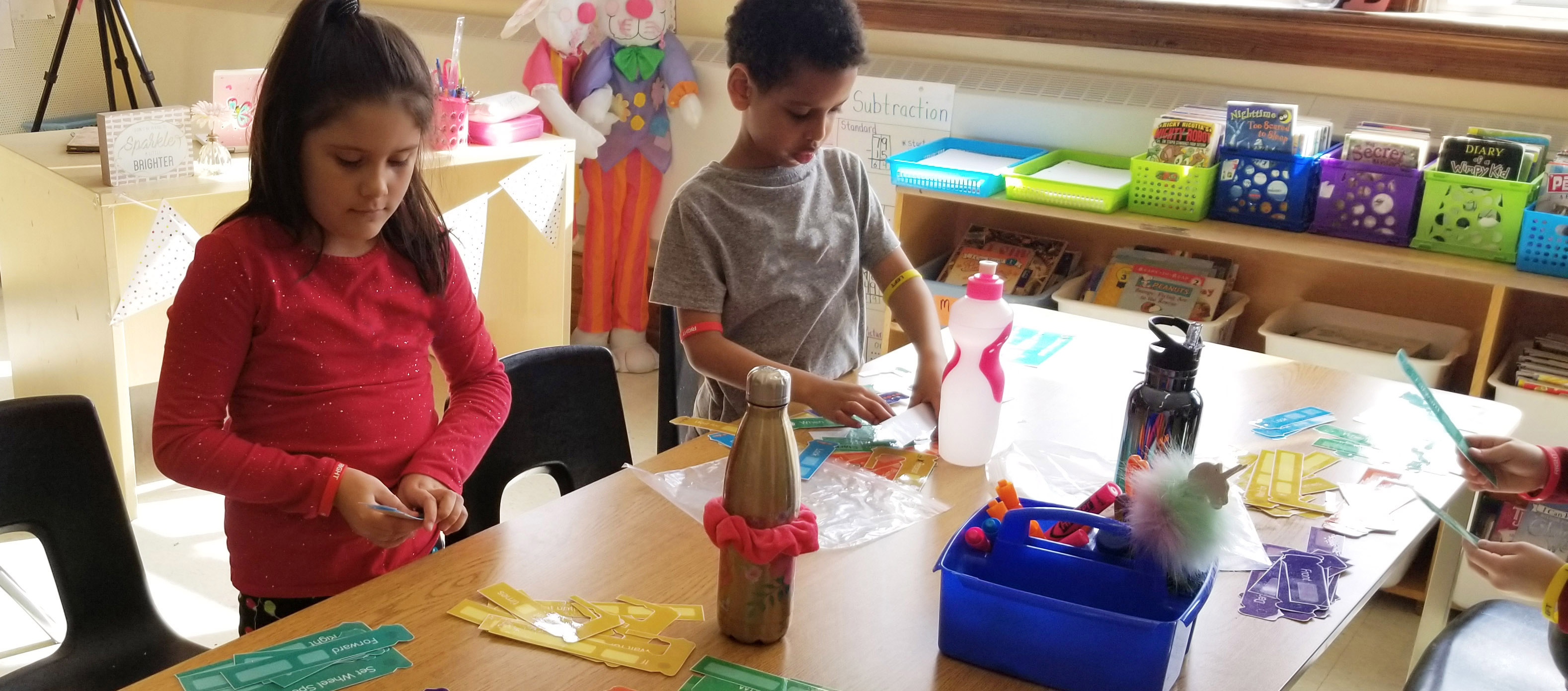 Image of two kids playing with a Debug'd kit