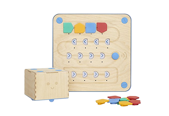 An image of Cubetto kit, including the robot and coding panel and coding tiles.